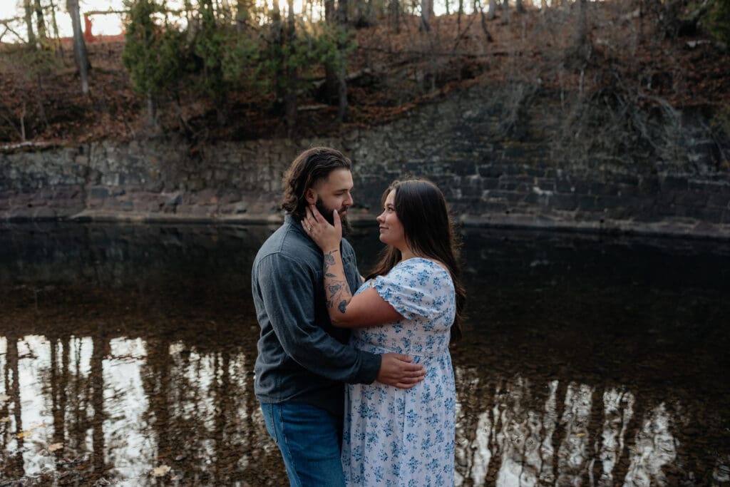 Joyful engaged couple sharing a moment during their Duluth Minnesota engagement session.