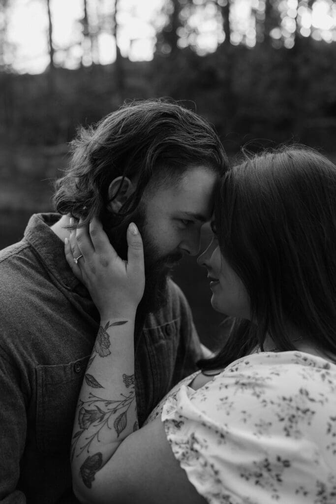 Romantic engagement photo at Glensheen Mansion in Duluth, Minnesota, with a couple embracing near the historic estate.